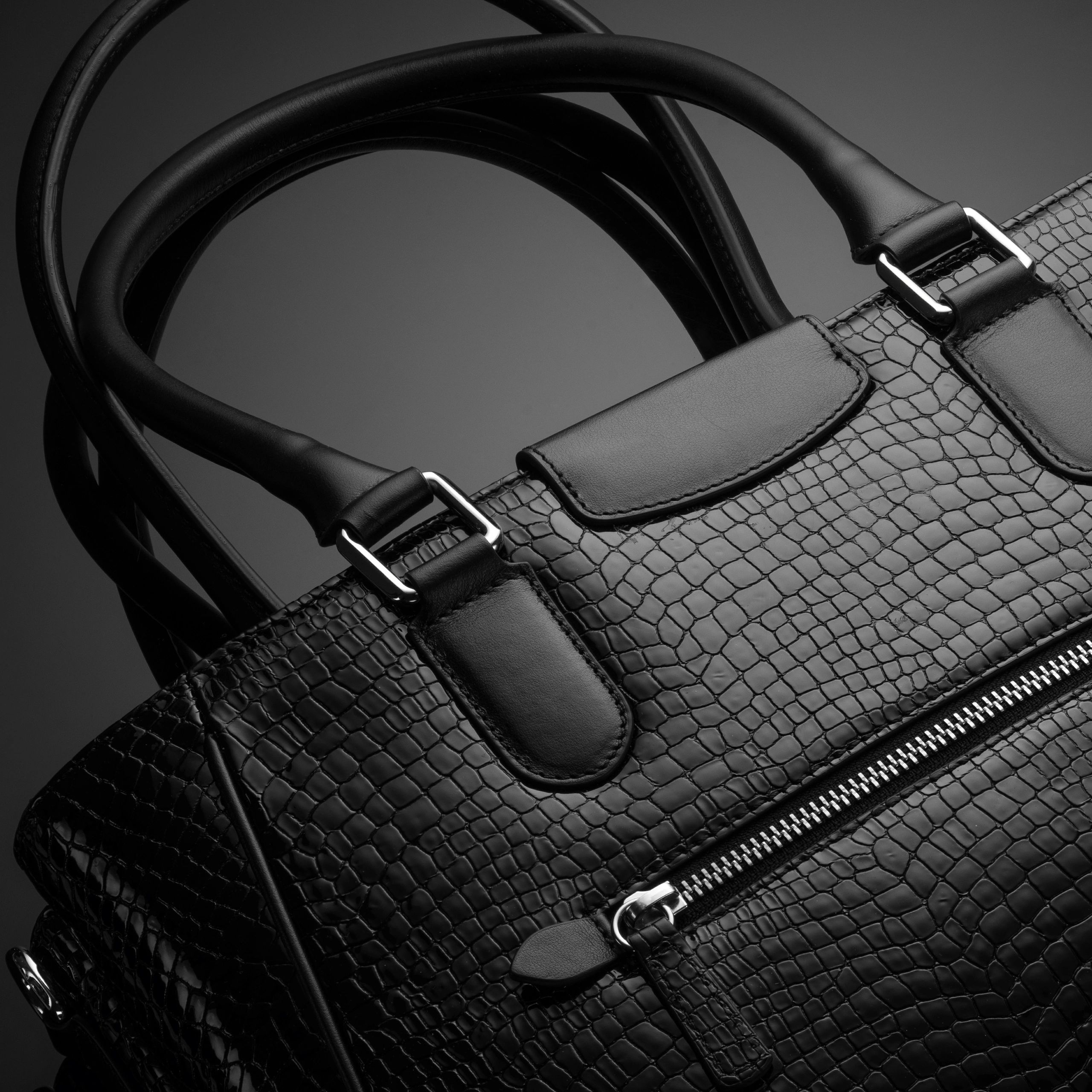Close-up of a black leather designer bag