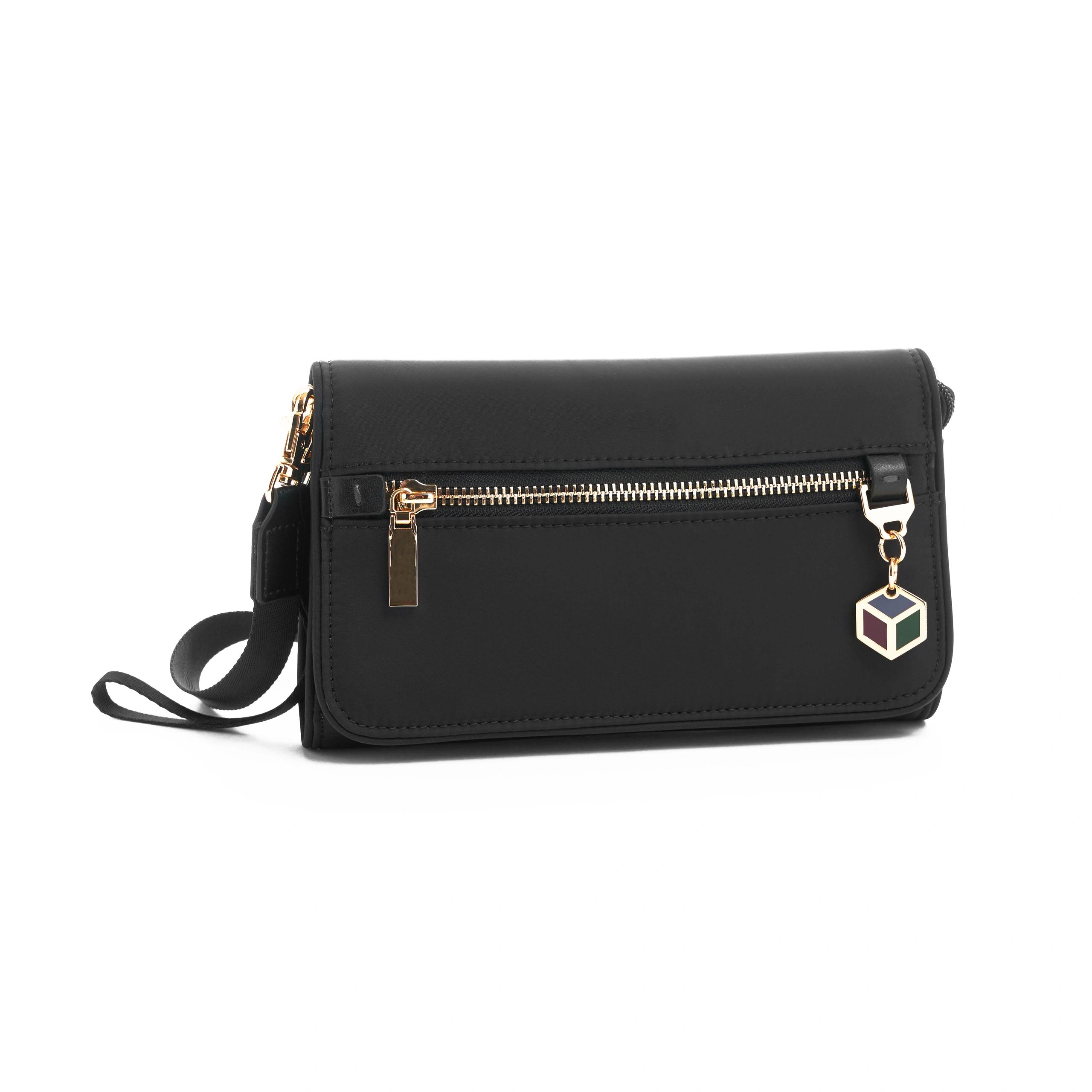Mica Minimal Crossbody Bag in black with subtle gold hardware — studio product image on clean background
