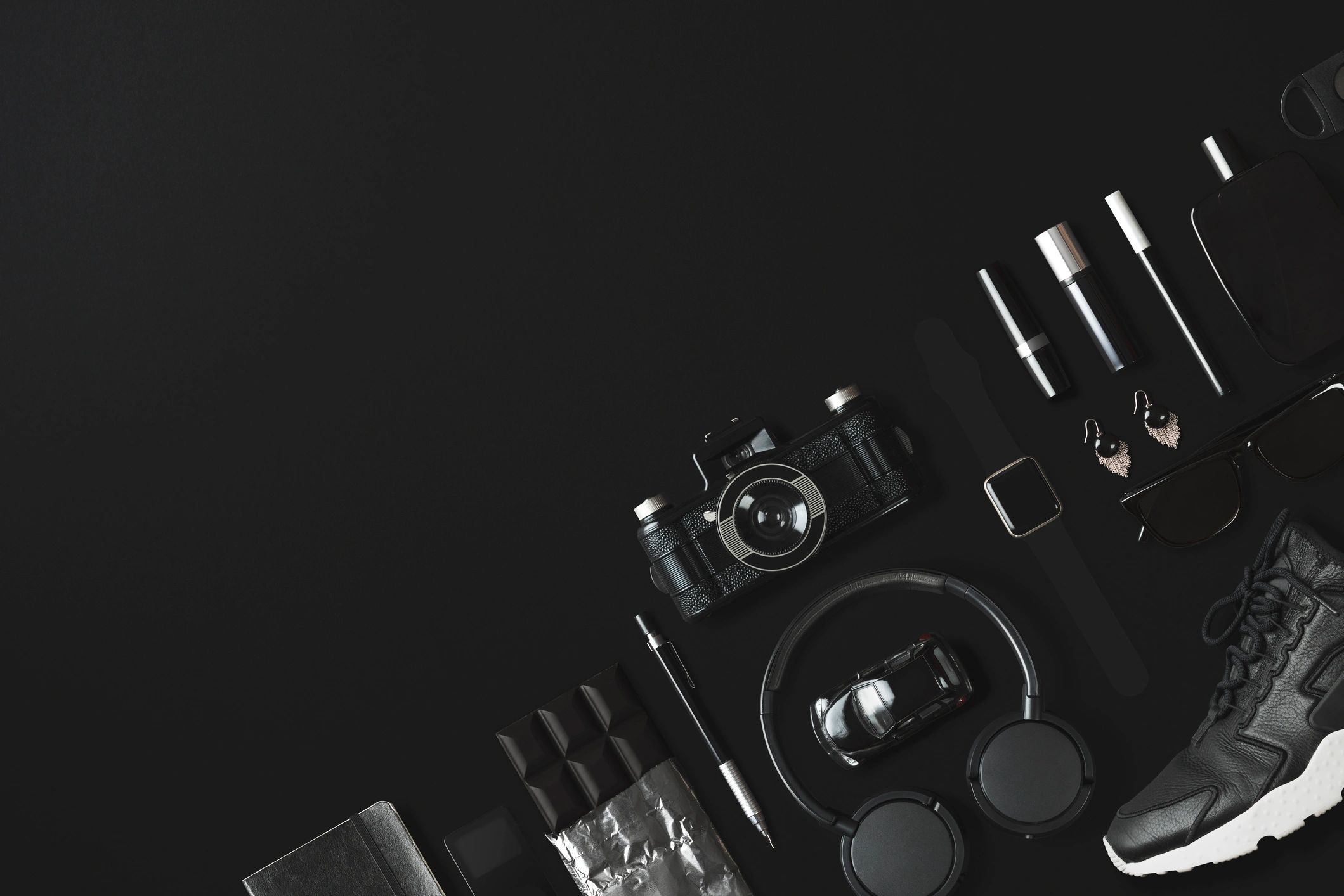 Black fashion flat lay on a black background